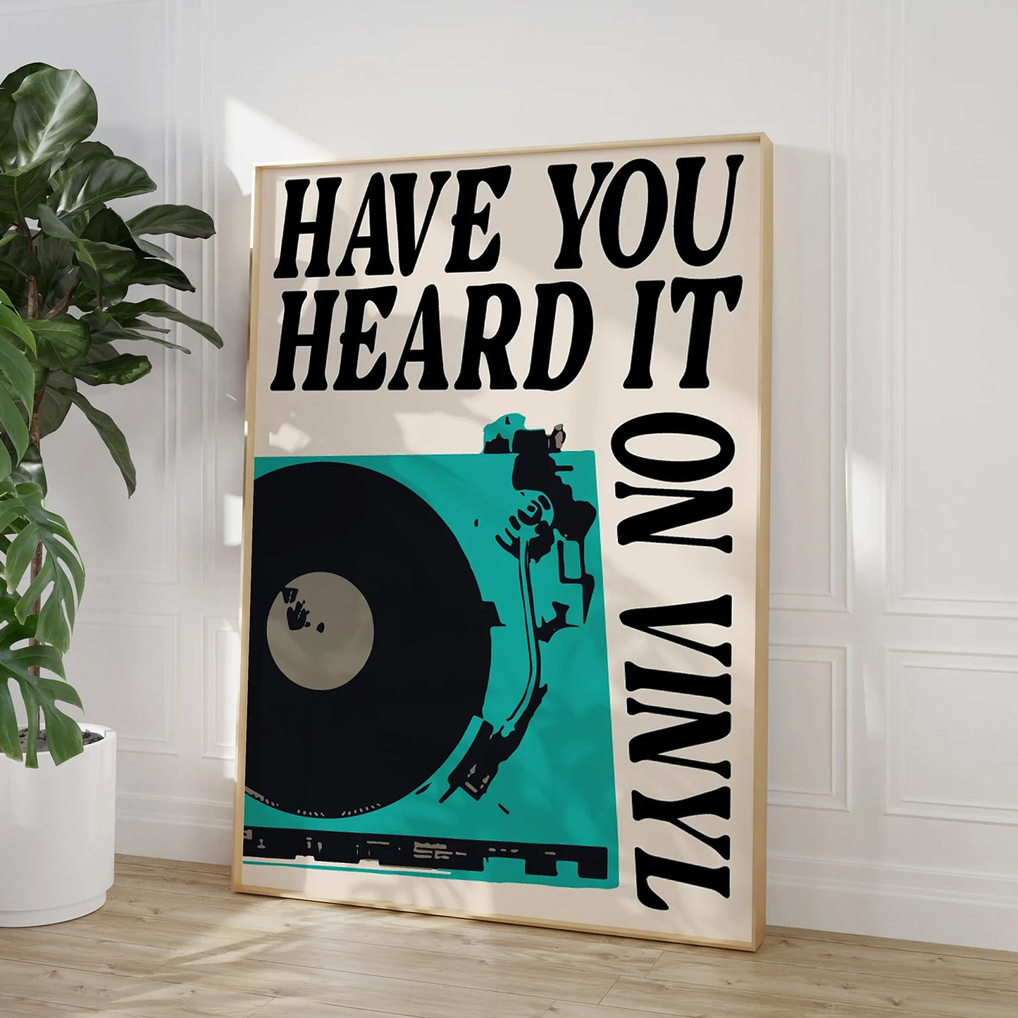 Bold typography wall art with a vinyl record player design in blue. Ideal for music fans and modern retro home decor.