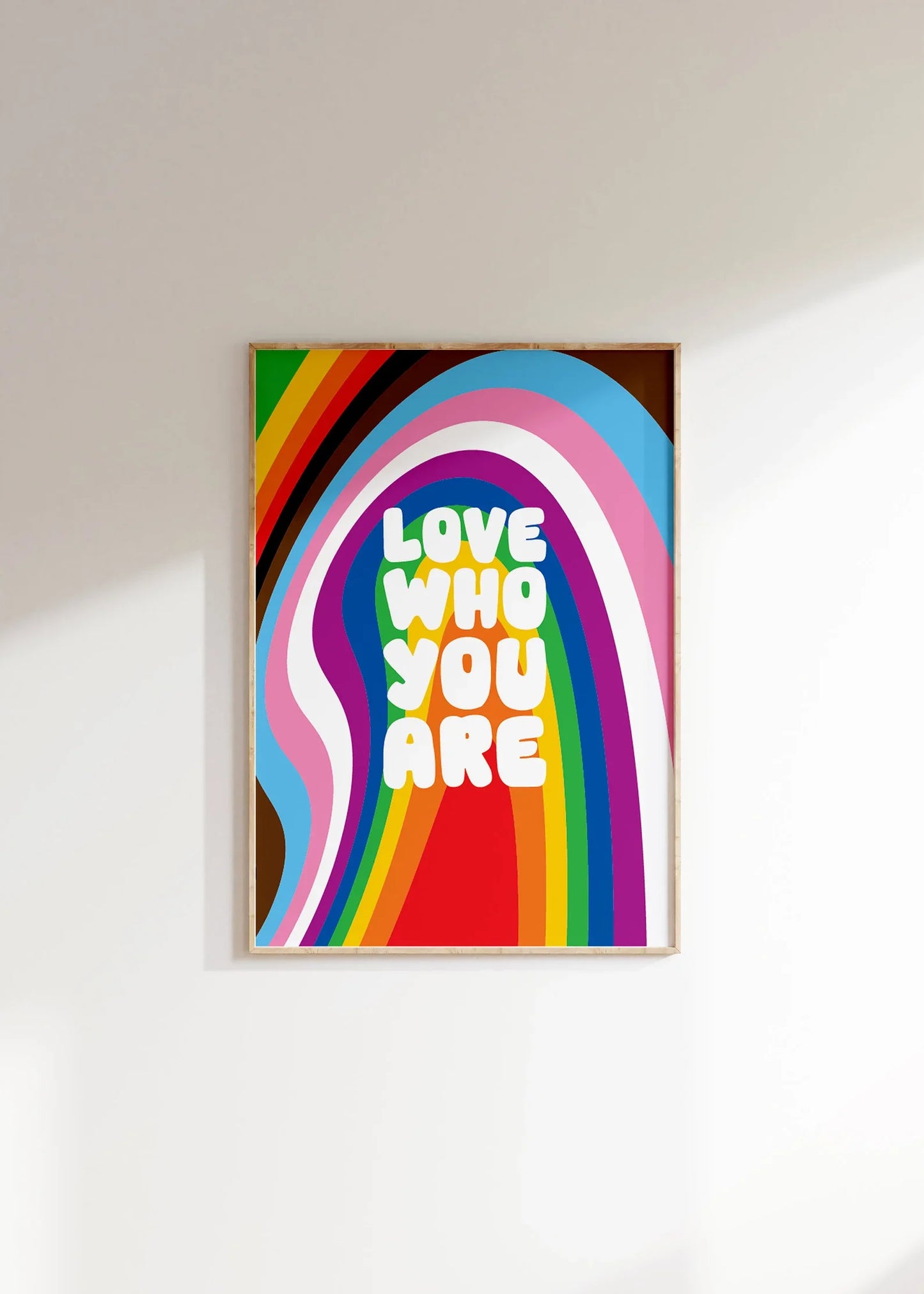 Love Who You Are print featuring bold retro typography and vibrant LGBTQ+ Pride flag colours, perfect for celebrating inclusivity and self-expression in home decor or as a Pride gift. Available in A5, A4, and A3 sizes.