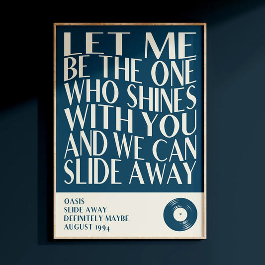 Bold wall art featuring Oasis lyrics in white text on a deep blue background, perfectly complementing the colour drenching trend with matching deep blue walls.