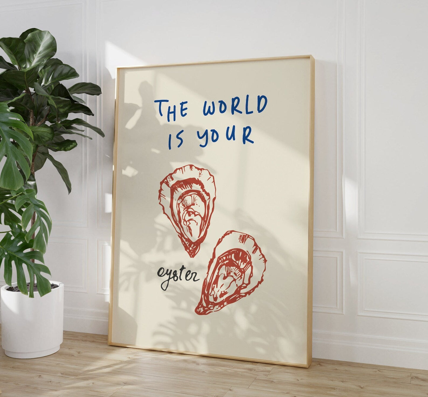 The World is Your Oyster kitchen wall art featuring a retro oyster illustration and bold typography, perfect for trendy dining room decor and unique gift ideas, available in A5, A4, and A3 sizes.